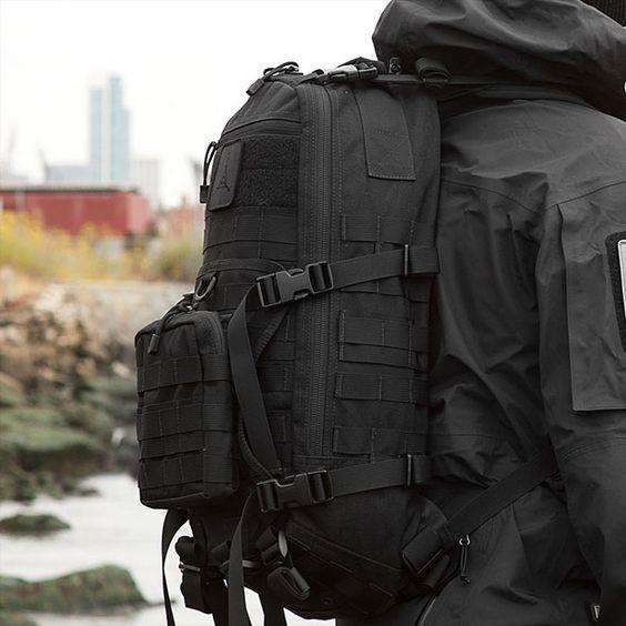 Black tactical MOLLE backpack in Cordura-like nylon
